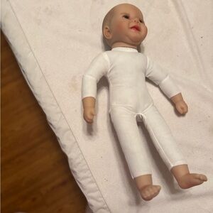 White Baby Doll with Smiling Face